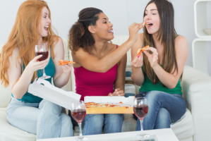 girls eating pizza at weed party